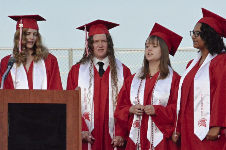 THE SENIOR members of the choir sing the school song. SHAWN RONEY | Staff