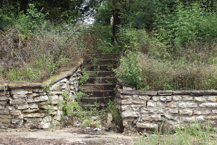 SHARON DONAT | Staff THE WALL NEAR the stairs leading to the Shotwell Cemetery will cost $40,000 to repair, according to Megan Pendleton.