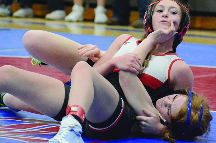A FIRST-ROW bleacher seat works fine to capture action on the mat. SHAWN RONEY | Staff