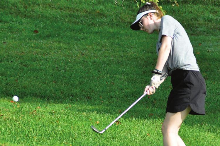 JUNIOR TORI BOWMAN works on her chip shot as she and her fellow Spartans wrap up their first week of girls golf practice Aug. 14 at Shirkey Golf Course in Richmond. SHAWN RONEY | Staff