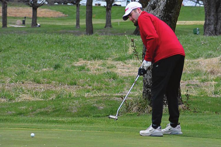 RICHMOND SENIOR Collin Cromley putts on a chilly Tuesday afternoon. SHAWN RONEY | Staff
