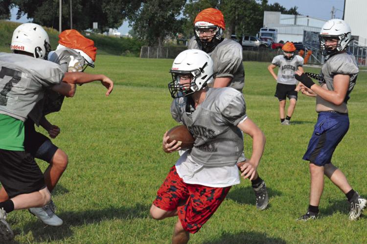 KALEL BOWMAN, shown carrying the football during a recent practice at Hardin-Central, wants to avenge the Aggies’ losses to Sweet Springs. SHAWN RONEY | Staff