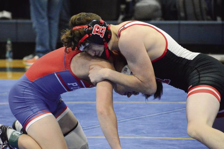 WRESTLING FROM the top position, Richmond junior Declan Cockrum works to break down California’s Patrick Morrow in the 120-pound fifth-place match at the Highway 13 Throwdown, hosted Jan. 28 by Lafayette County. SHAWN RONEY | Staff