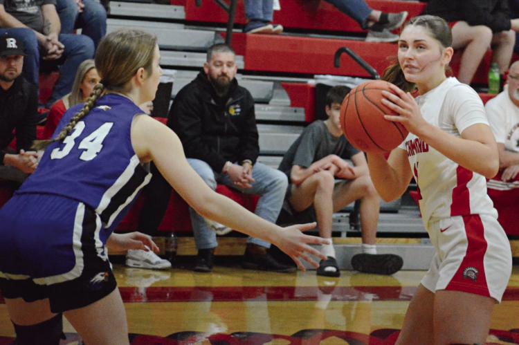 RICHMOND JUNIOR Candiace Claypole (right) looks to pass while guarded by Holden’s Annie Zillner. SHAWN RONEY | Staff