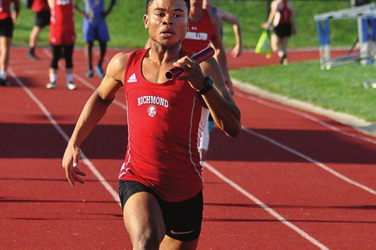 WITH A commanding lead, Richmond senior Adrian Church brings home the win for Richmond in the boys 400-meter relay April 29 at Lexington, but a school record barely eludes Church and his teammates. SHAWN RONEY | Staff