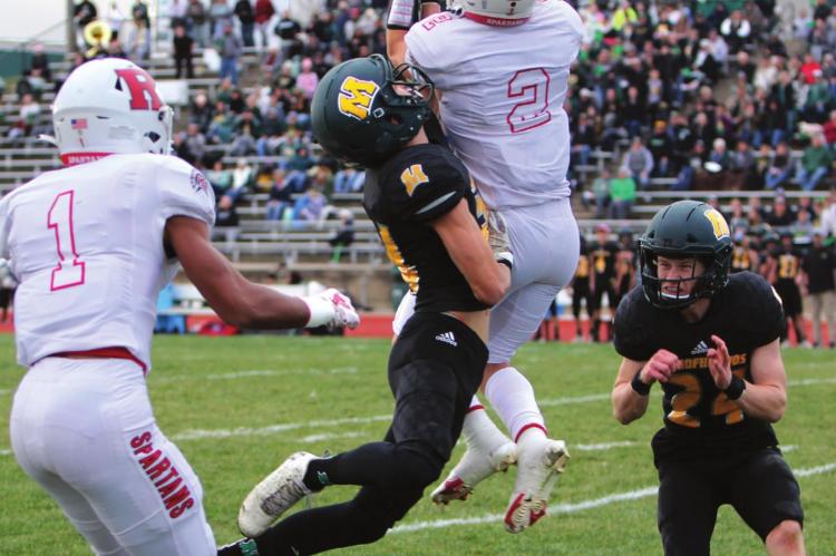 AFTER SURPRISING the Spoofhounds by faking a punt, Richmond senior quarterback Keyshaun Elliott throws a 25-yard pass from the 37 to senior