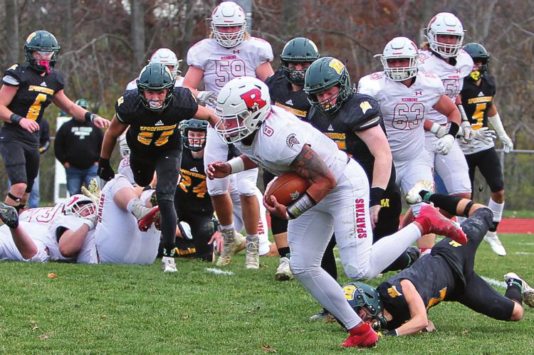 RICHMOND senior quarterback Keyshaun Elliott rushes for five touchdowns in the quarterfinal championship game Nov. 20 against Maryville.