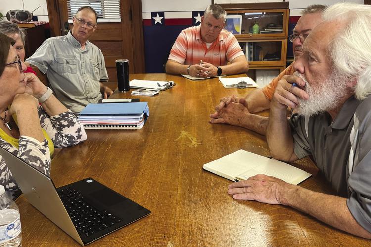 Excelsior Springs City Manager Molly McGovern (from left), Economic Development Coordinator Melinda Mahaffey and Downtown Excelsior Partnership (DEP) volunteer Keith Hudson visit Ray County Commissioners Billy Gaines, Gay Wilhite and Dave Powell. Excelsior Springs personnel asked for support as they studied the city’s flooding issues. SOPHIA BALES | Staff