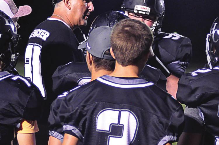 RICHMOND HIGH SCHOOL graduate Kirk Thacker, seen here in 2020 in a crowd of his Norborne Hardin-Central varsity 8-man football players, has taken the helm of Orrick’s varsity 8-man program. SHAWN RONEY | Staff