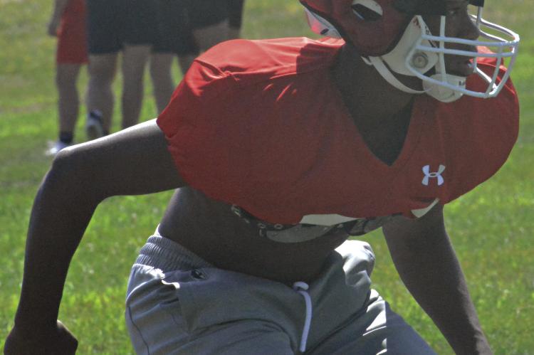 CHRIS WEBB works on his pass coverage technique during Richmond’s team camp for varsity 11man football Monday morning on the practice field on the high school campus. Webb and his fellow Spartans will have another series of camp sessions July 17-20 at the high school. SHAWN RONEY | Staff
