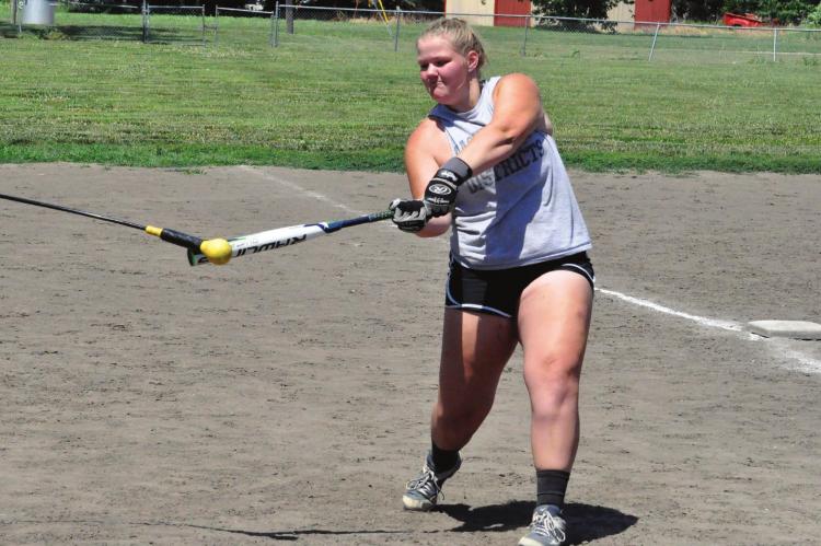 HARDIN-CENTRAL senior Morgan Finley practices her swing Tuesday during a camp for grades 7-12. SHAWN RONEY | Staff