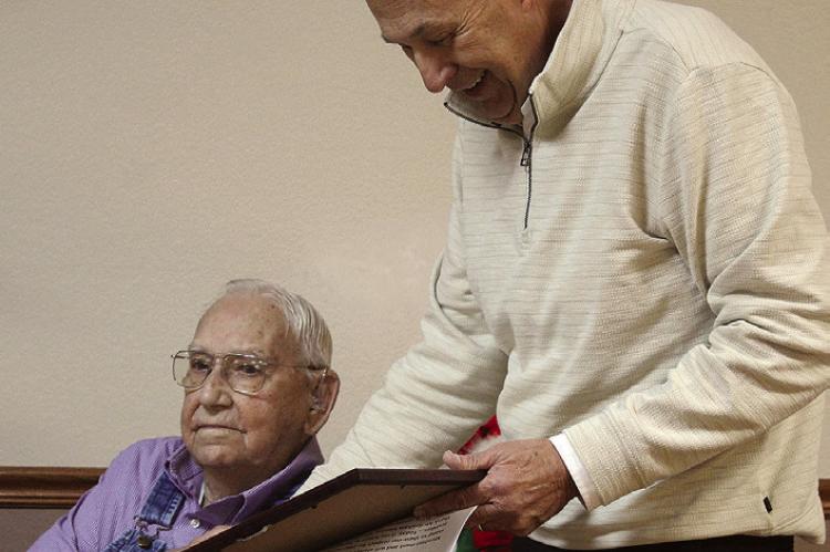 STATE REP. TERRY THOMPSON (right) presents a Missouri House resolution honoring World War II veteran Graham C. Myers Jr. for his naval service. SHARON DONAT | Staff