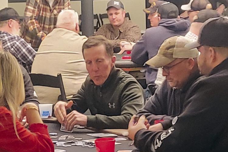 RICHMOND EDUCATION FOUNDATION President Dr. Jonathon Renfro contemplates his next move during the annual Texas Hold’em Fundraiser. SHARON DONAT | Staff