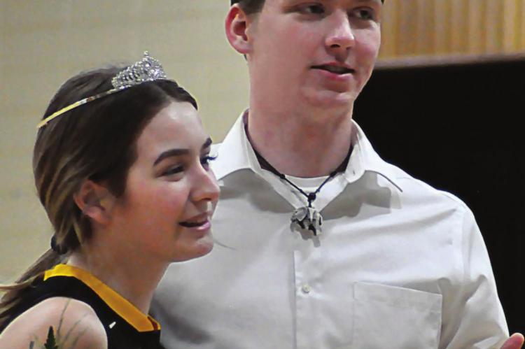 SENIOR ANNA PARKER enjoys the honor of being named court warming queen after Orrick’s 57-17 Jan. 21 loss to Tina-Avalon/Norborne. Fellow senior Chanler Woods is crowned king. SHAWN RONEY | Staff