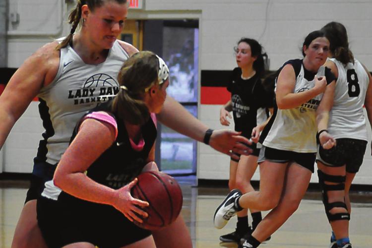 HER ARMS outstretched, Hardin-Central senior Morgan Finley works on her defensive skills Nov. 8 in the Hardin-Central gym. SHAWN RONEY| Staff