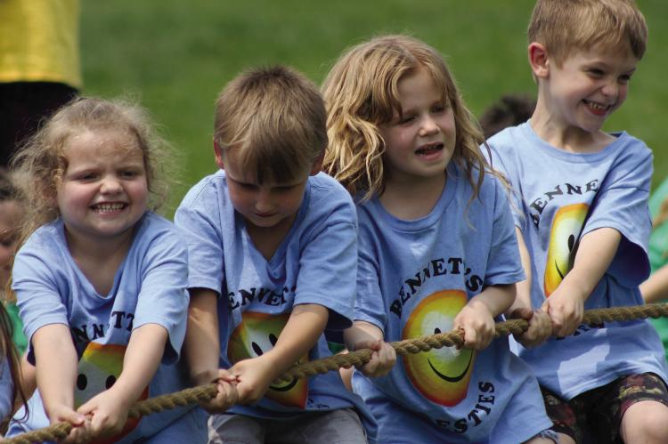 HARPER BIRDSONG (from left), Kane Edgman, Maddie Williams and Wrangler Lee pull with all their might. See more Field Day photos on Page 12. SOPHIA BALES | Staff