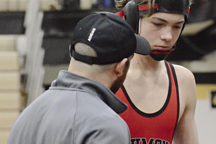 RICHMOND JUNIOR Brady Hyder (right) receives some coaching during the Class 2 District 4 Tournament. SHAWN RONEY | Staff