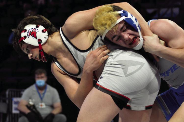 RICHMOND WRESTLING coach Cody Hogan sees Elijah Sanders, left, pictured wrestling in 2021, as a state title contender in February 2023. SHAWN RONEY | Staff