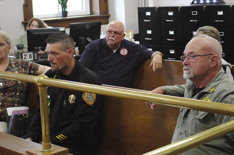 WOOD HEIGHTS MAYOR Michelle Lambert (from left), Wood Heights Police Officer Brandon Ehlen, Hardin Fire Chief Malcom Cunningham, Orrick Fire Chief Kelly Bilton and Ray County Sheriff Gary Blackwell discuss the importance of having a county emergency management director during disasters. SHARON DONAT | Staff