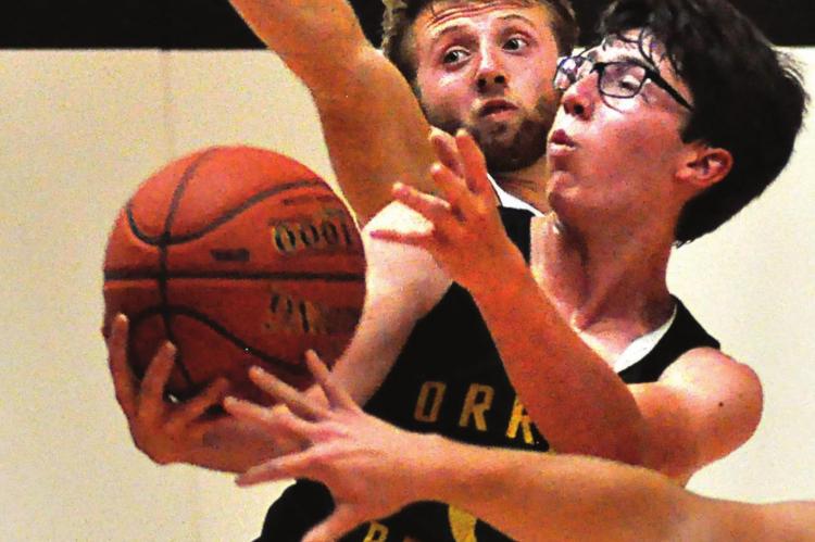 SOPHOMORE JONATHON HARRIS makes a contested drive for the Bearcats Monday during summer-league competition at Lawson. SHAWN RONEY | Staff