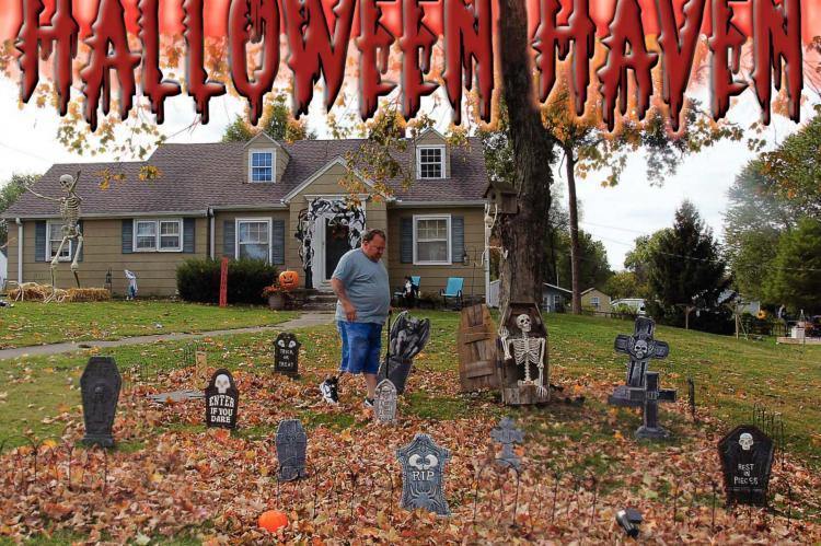AT 707 E. LEXINGTON ST., Tim Glynn walks across his front yard and crunches into the leaf-strewn graveyard created for expected Halloween visitors. J.C. VENTIMIGLIA | Staff