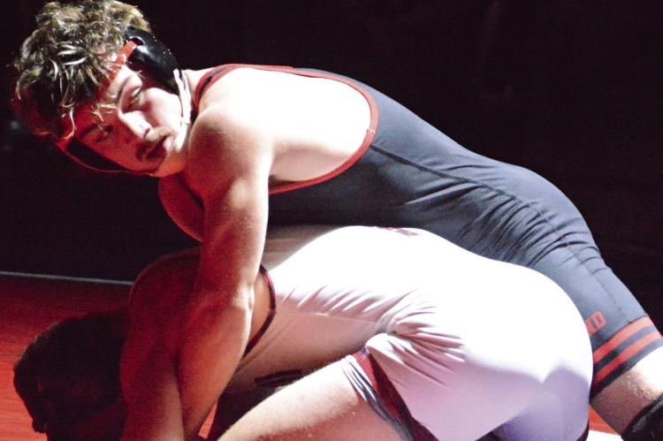 MACK MISENHELTER has the upper hand in his 165-pound match during Richmond’s varsity boys wrestling dual with Lexington. SHAWN RONEY | Staff