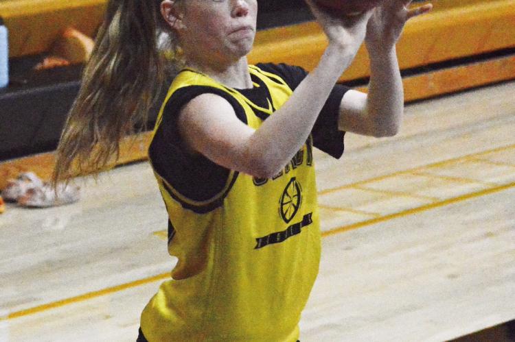 ADDISON CHAPMAN attempts a perimeter shot during Orrick’s combined practice with Hardin-Central July 13 in the Orrick High School gym. SHAWN RONEY | Staff