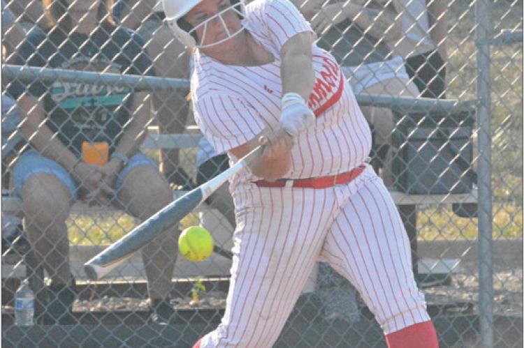ELIZABETH WOOD swings at a pitch Monday against Lexington at Southview Park in Richmond. SHAWN RONEY | Staff