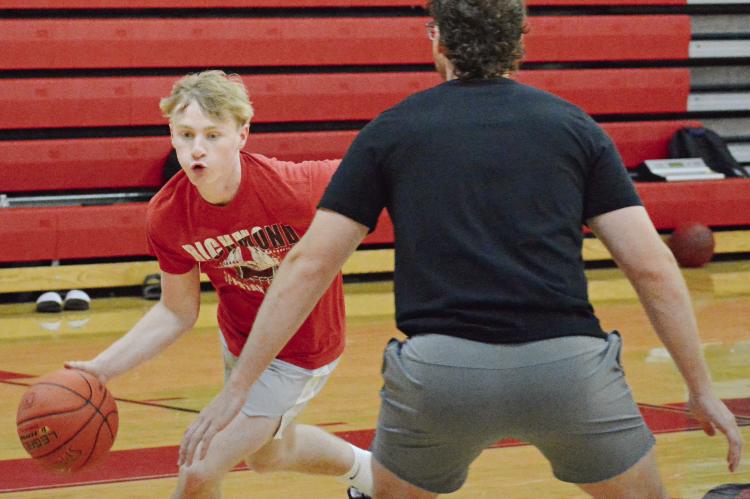NOLAN QUICK (left) drives with the ball during a drill while at a Richmond boys basketball camp session for high schoolers. Additional coverage is on page 12. SHAWN RONEY | Staff