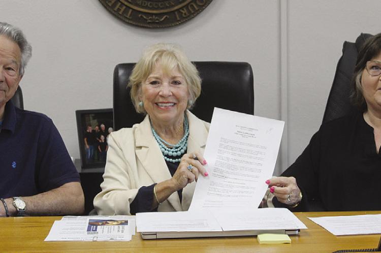 COMMISSIONER MAX HOCKEMEIER (from left), Presiding Commissioner Shelia Tracy and Ray County Collector Julie Chowning present a proclamation recognizing Child Abuse Awareness Month and encouraging residents to wear blue, as well as attend an April 29 courthouse event. MIRANDA JAMISON | Staff