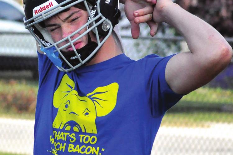 BRAYDEN SCHICK stretches Monday at Hardin-Central as he and his fellow NHC Aggies begin work to pursue their second victory this season. SHAWN RONEY | Staff