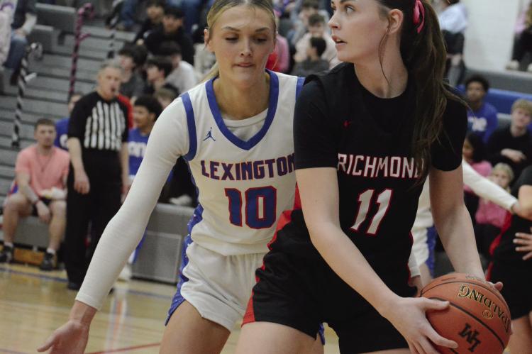 RICHMOND POST PLAYER Candiace Claypole shields the ball from Lexington’s Ardyn Hamacher. SHAWN RONEY | Staff