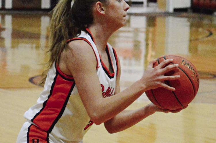 ESTER KINCAID considers her next move during the first half of Hardin-Central’s Feb. 1 home meeting with Wellington-Napoleon. SHAWN RONEY | Staff