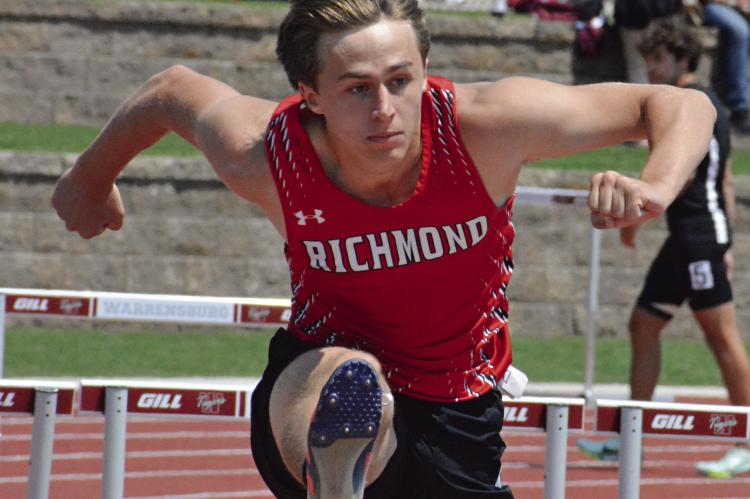 DAYNE LOFTIN bolts over a hurdle during the finals of the boys 110-meter high hurdles at the Class 3 Sectional 4 meet, held recently at Warrensburg High School. SHAWN RONEY | Staff