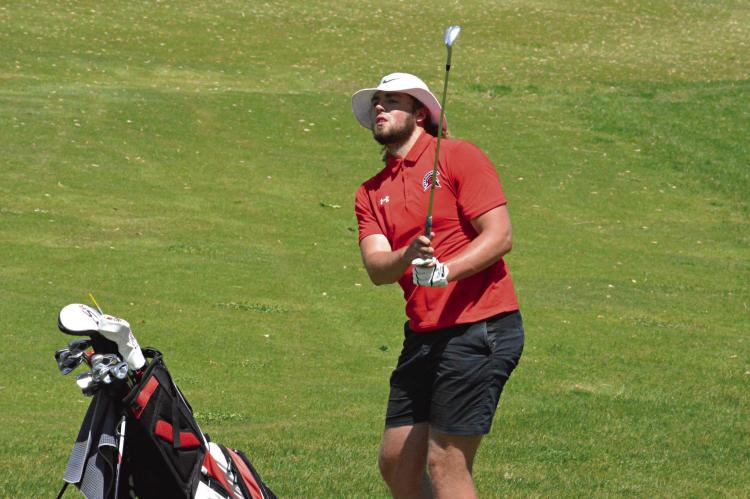 SOON-TO-BE Richmond graduate Jack Gogue watches his chip shot near the end of his round Monday at the Class 3 District 4 Tournament at Shirkey Golf Course. SHAWN RONEY | Staff