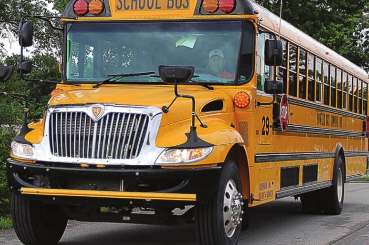 SERVING THE RICHMOND School District, this bus drives last week along East South Street between the high school and junior high school. J.C. VENTIMIGLIA | Staff