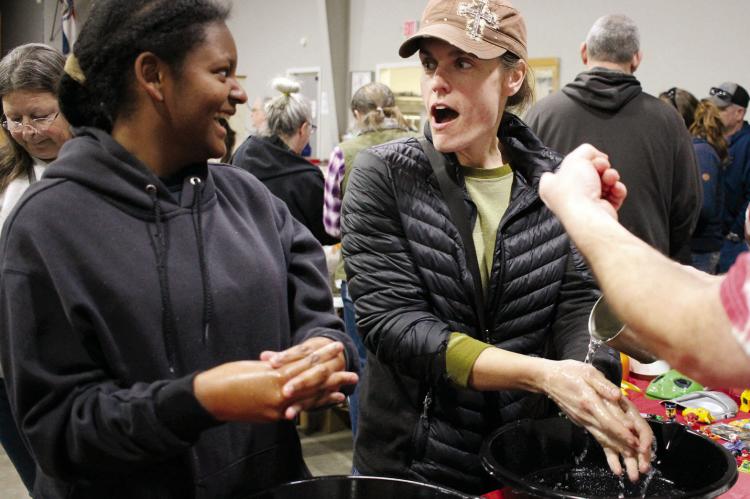 DAKOTA AND REVA BELL are shocked by the scrub they are trying, which is called Mountain Man Skrub. They are attending the First Annual Homesteading in Ray County Regional Swap Meet and Convention. The two enjoy walking around and scanning booths. SOPHIA BALES | Staff