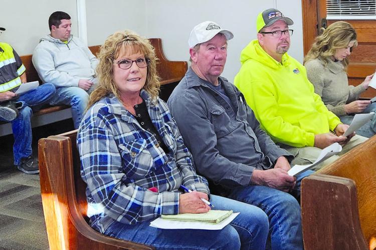 LOCAL TOW OPERATORS and community members review a draft resolution outlining potential changes to towing policies in Ray County. MIRANDA JAMISON | Staff