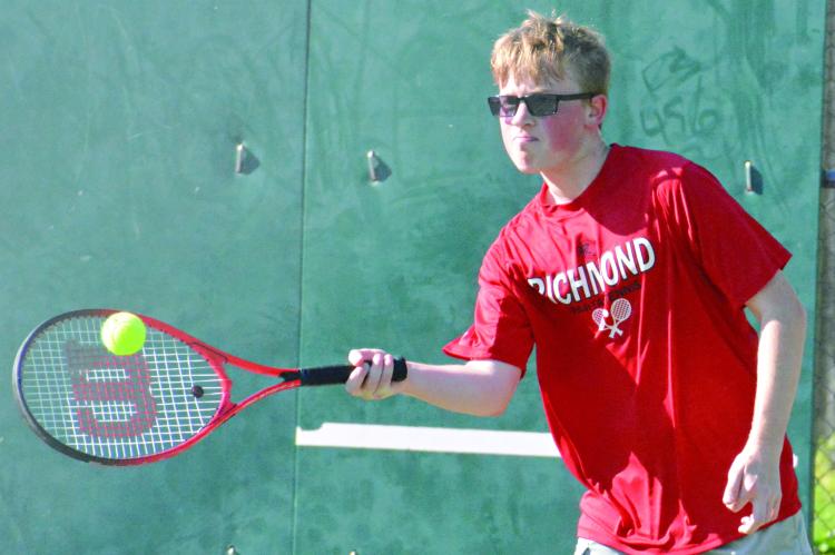 SOPHOMORE PAXTON QUICK attempts a forehand shot in singles play during Richmond’s week-opening dual with Carrollton. After edging Carrollton 5-4 April 15 on the road, the Spartans drop the rematch 5-4, also their final home competition of the regular season. Richmond is slated to finish its regular-season dual schedule Friday at Odessa. SHAWN RONEY | Staff