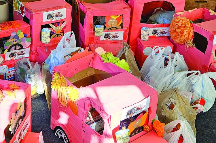 STUFFED RED TRUCK turkey boxes fill the Richmond News lobby before being delivered to the Richmond United Methodist Food Pantry. MIRANDA JAMISON | Staff