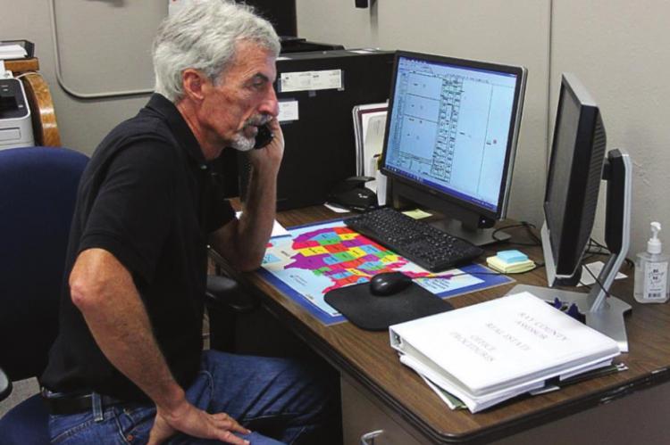 ASSESSOR Kent Wollard works even on his last day.