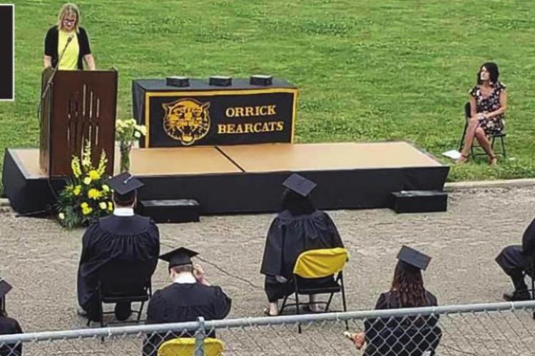 MICHELLE WITYK addresses the Class of 2020, which gathers to participate in graduation after weeks of delay caused by the COVID-19 pandemic.