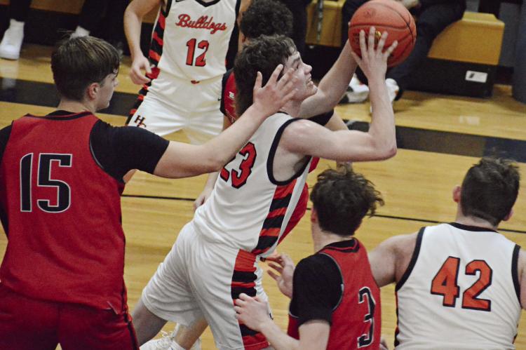 CALEB GANT leans in as he attempts a shot during the first half of Hardin-Central’s Class 1 District Tournament semifinal meeting with Northland Christian Feb. 22 at Norborne. SHAWN RONEY | Staff