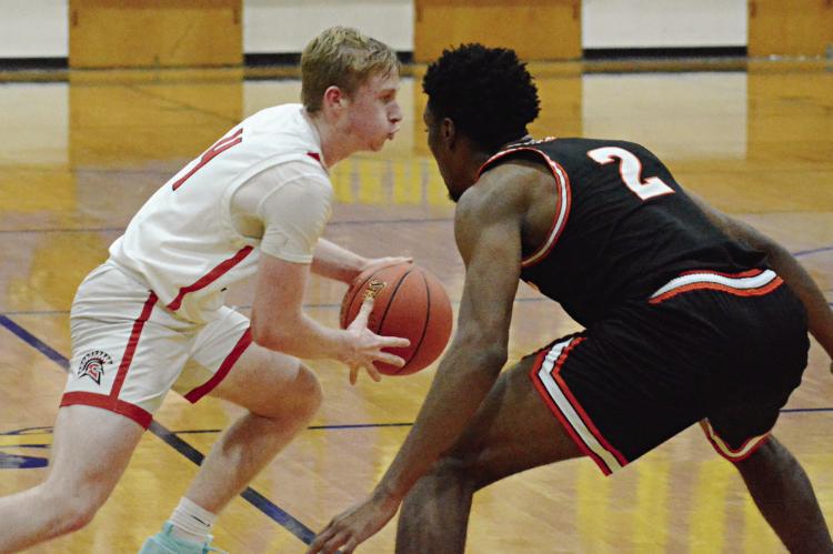 RICHMOND LOOKS to start the new year by getting back to .500 in varsity boys basketball. SHAWN RONEY | Staff