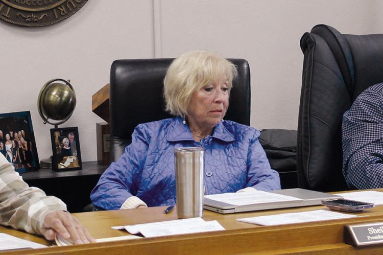 RAY COUNTY COMMISSIONERS Max Hockemeier (from left), Shelia Tracy and Bobby Don Davis listen to public comments as residents raise concerns about drainage issues, county procedures and roadway maintenance. MIRANDA JAMISON | Staff