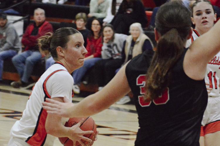SENIOR ESTER KINCAID (left) drives against the Braymer defense. Kincaid helped the Hardin-Central varsity girls post a 56-40 win. The Jan. 22 home victory put the girls at 10-5 overall entering this week. SHAWN RONEY | Staff