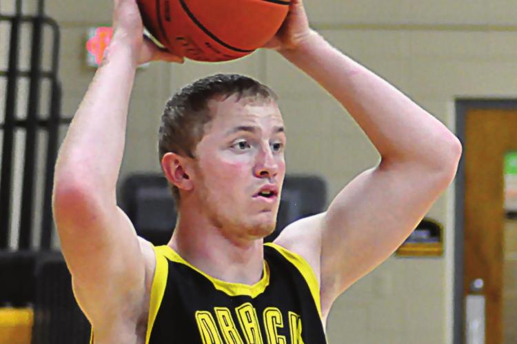 SENIOR BLAKE BUCHANAN looks to pass during a November practice. SHAWN RONEY | Staff