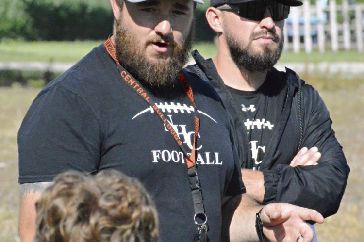 WITH HIS WHISTLE resting against his T-shirt, Norborne Hardin-Central varsity 8-man football coach Andrew Watson addresses his players and staff after their June 6 team camp session at Hardin-Central. SHAWN RONEY | Staff