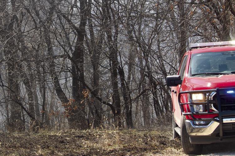 THE RICHMOND FIRE DEPARTMENT extinguishes a grass fire on Vandiver Road. Fire Chief Mark Sowder stated this was the fifth grass fire the department had responded to in just two days. MIRANDA JAMISON | Staff