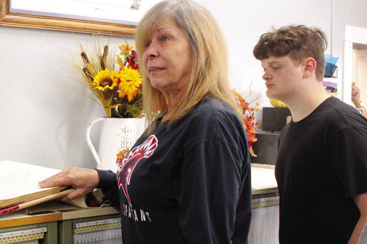RAY COUNTY RECORDER of Deeds Rhonda Kinnison (left) explains how deeds are recorded and filed to workforce math student Jonathan Calkins. Submitted